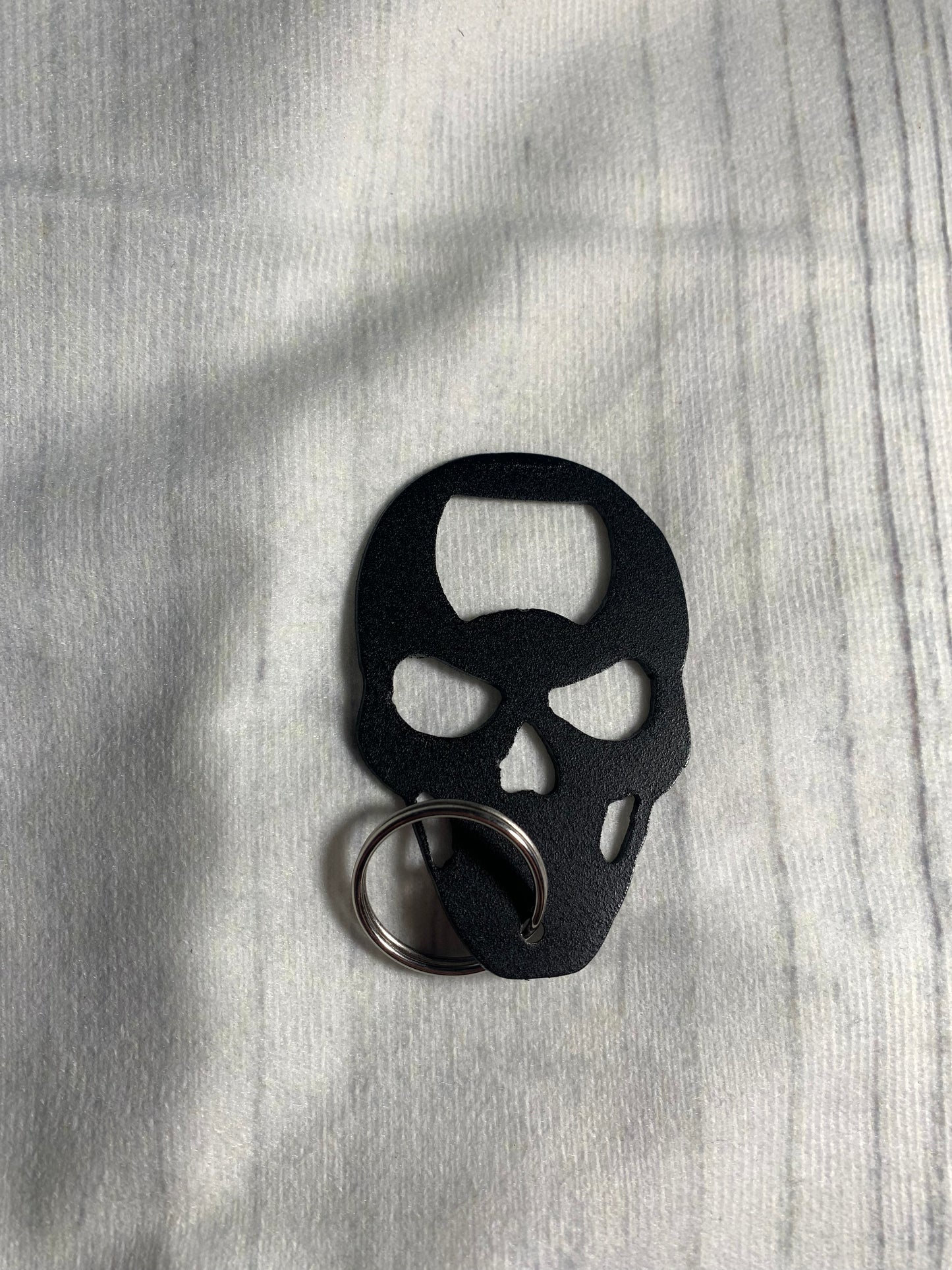 Skull shaped keychain bottle opener
