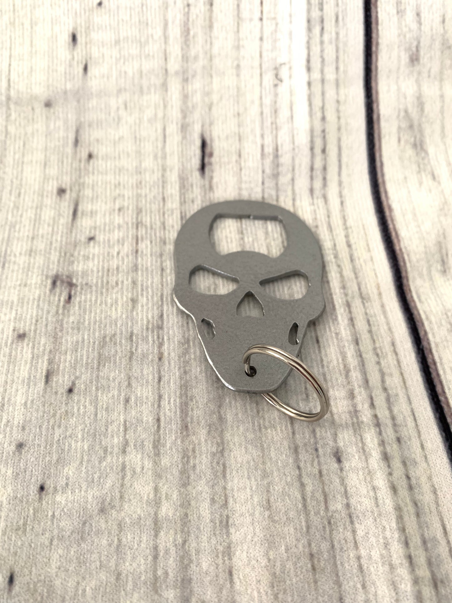Skull shaped keychain bottle opener