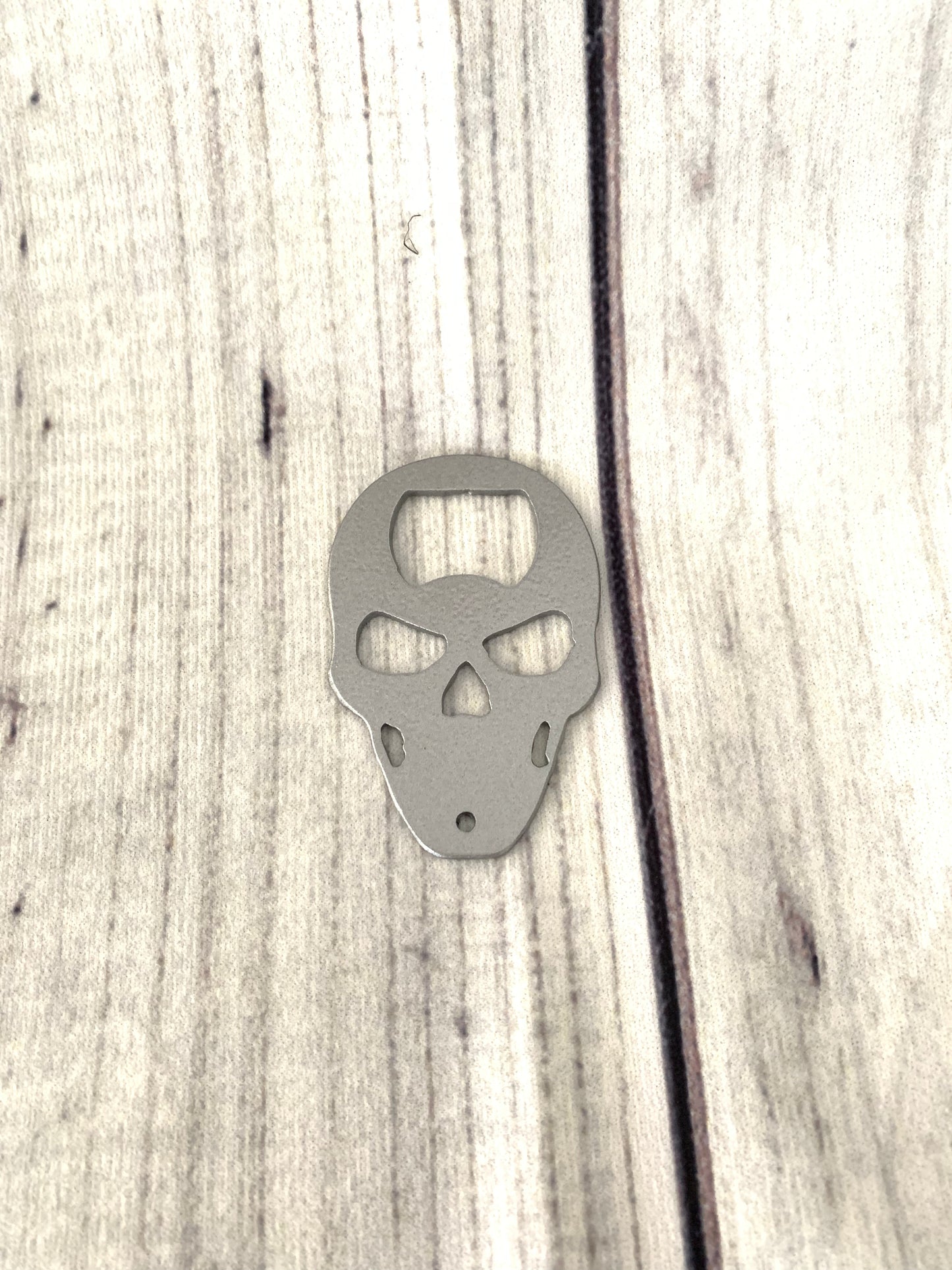 Skull shaped keychain bottle opener